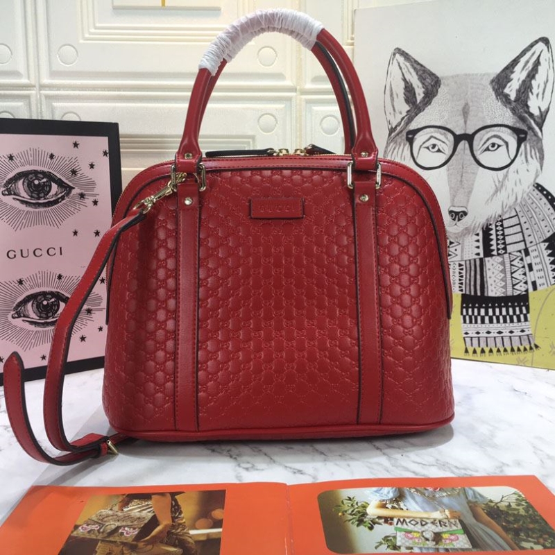 G*u*i top handle bags